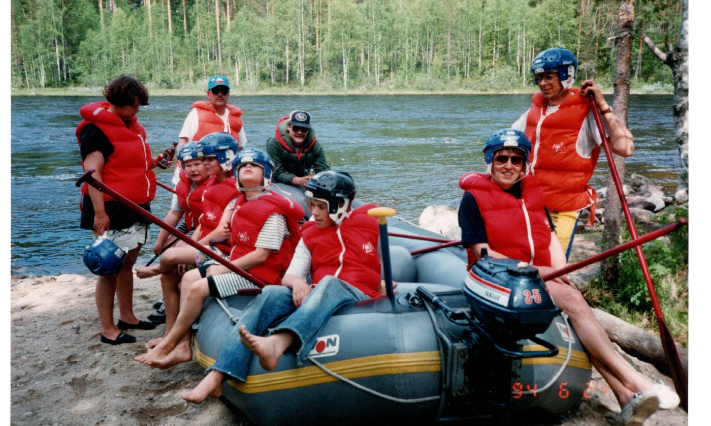 Family group in a raft at the riverbank, June 1994